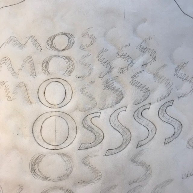 Pencil drawing of letters to be carved